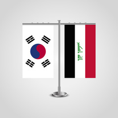Table stand with flags of South Korea and Iraq.Two flag. Flag pole. Symbolizing the cooperation between the two countries. Table flags
