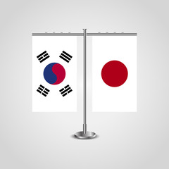 Table stand with flags of South Korea and Japan.Two flag. Flag pole. Symbolizing the cooperation between the two countries. Table flags