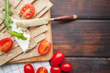 Diet food ingredients on dark wooden background