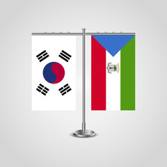 Table stand with flags of South Korea and Equatorial Guinea.Two flag. Flag pole. Symbolizing the cooperation between the two countries. Table flags