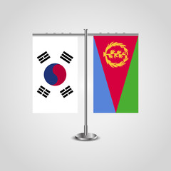 Table stand with flags of South Korea and Eritrea.Two flag. Flag pole. Symbolizing the cooperation between the two countries. Table flags
