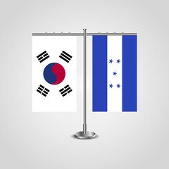 Table stand with flags of South Korea and Honduras.Two flag. Flag pole. Symbolizing the cooperation between the two countries. Table flags