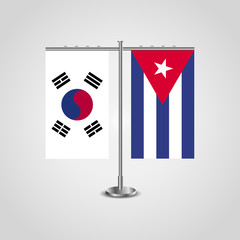 Table stand with flags of South Korea and Cuba.Two flag. Flag pole. Symbolizing the cooperation between the two countries. Table flags