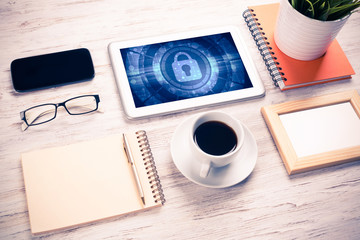 Web security and technology concept with tablet pc on wooden tab