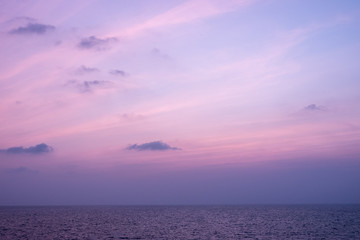 Twilight sunset sky with beautiful clouds over sea