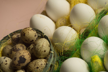 White chicken Chicken and quail eggs in colored paper eco-friendly packaging with  sisal Close-up photo Easter background 