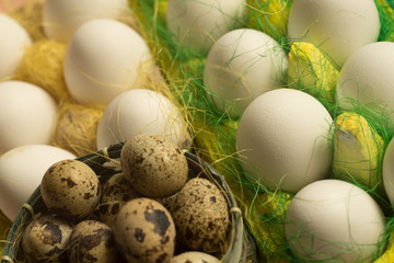 White chicken Chicken and quail eggs in colored paper eco-friendly packaging with  sisal Close-up photo Easter background 