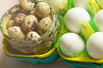 White chicken Chicken and quail eggs in colored paper eco-friendly packaging with  sisal Close-up photo Easter background 