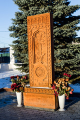 Fototapeta na wymiar Monument (Khachkar) for 100th anniversary of Armenian Genocide, village Belkino, Russia. Armenian cross-stone 