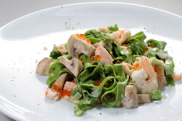 European cuisine pasta with mushrooms seafood and spinach