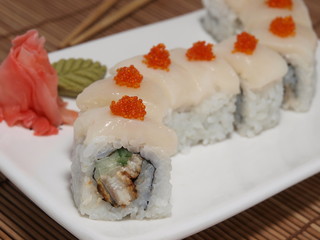 Japanese cuisine appetizing rolls with flying fish roe