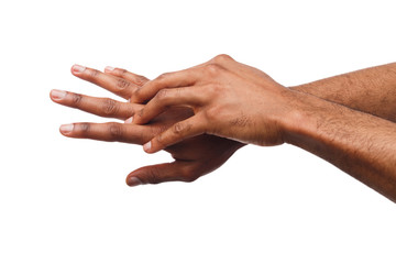 Black man applying hand cream at white isolated background