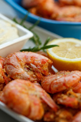 row tiger shrimp with lemon on white