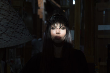 Fototapeta premium Portrait of a young beautiful woman in Arabic style with a decoration on her head.