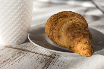 cup of coffe with croissant