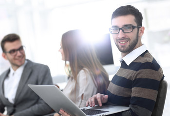 closeup.man working on laptop