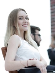 young business woman sitting at a desk in the office .