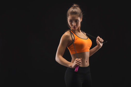 Athletic woman with skipping rope