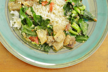 stir fried Chinese kale and crispy pork with chili on rice