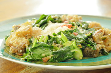 stir fried Chinese kale and crispy pork with chili on rice