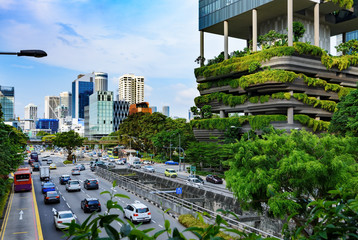 Urban life in Singapore: skyscrapers and tropical plants under deep blue sky - 200762336