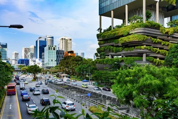 Foto op Plexiglas Urban life in Singapore: skyscrapers and tropical plants under deep blue sky © Oleksii Fadieiev