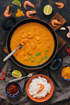 Asian Food Shrimp In Curry Sauce, Rice And Spices.Indian Or Thai Dish. View From Above.