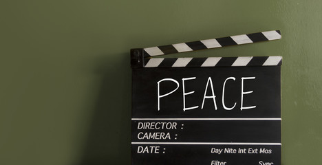 Fototapeta na wymiar The title Peace on film Clapperboard