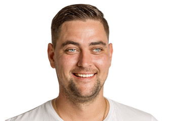 Obraz premium Cute young man laughing, isolated on white background