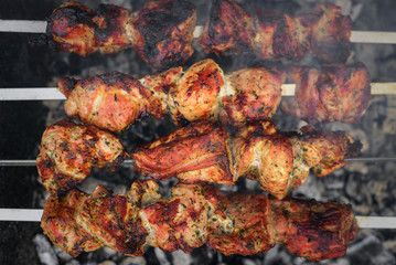 Barbecue or shish kebab is fried on the grill.