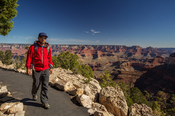 Fototapeta premium A hiker in the Grand Canyon National Park, South Rim, Arizona, USA