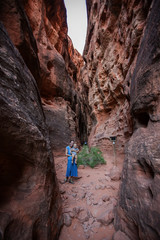 Mother and son on a trail in volcanic Snow canyon State Park in Utah, USA