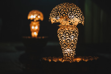  shiny background of illuminated beautiful lighting lamps, closeup view
