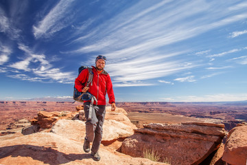 Fototapeta premium Hiker in Canyonlands National park in Utah, USA