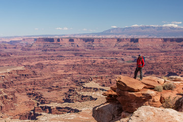 Naklejka premium Hiker in Canyonlands National park in Utah, USA