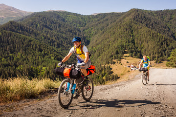 Fototapeta na wymiar Mountain bikers are travelling in the highlands of Tusheti region, Georgia