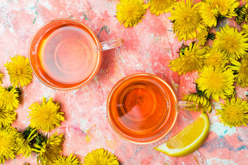 Dandelion tea and fresh flowers on a table