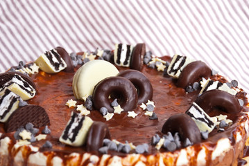 Traditional cake three chocolates. Mousse glaze darkness decoration cake.