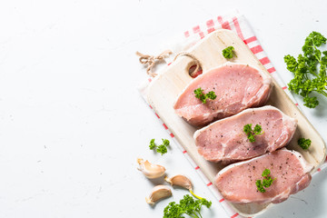 Pork meat steak, slices pork loin on white. 