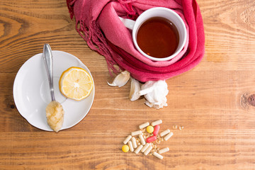 concept of healthy new and old ways of healing on a white background and wooden table from above