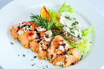 salmon roll with fresh vegetables and black caviar