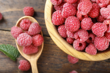 Fresh raspberry in a wooden plate