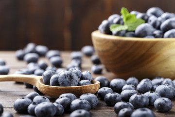 ripe organic bog whortleberry in a wooden plate