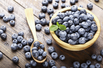 ripe organic bog whortleberry in a wooden plate