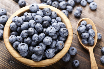 ripe organic bog whortleberry in a wooden plate