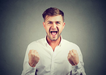 Successful man with fists up