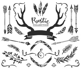 Hand drawn vintage antlers, feathers, arrows with lettering. Rustic decorative vector design set.