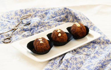  russian cake Kartoshka chocolate truffle potatoes. Rum balls of vanilla biscuit with cocao powder, butter cream and nuts