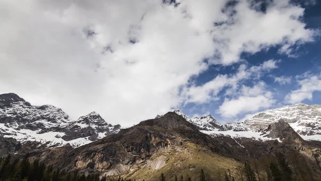 4K Time-Lapse of Snow mountains on blue sky at Yading national reserve in Daocheng County, Sichuan Province, China.