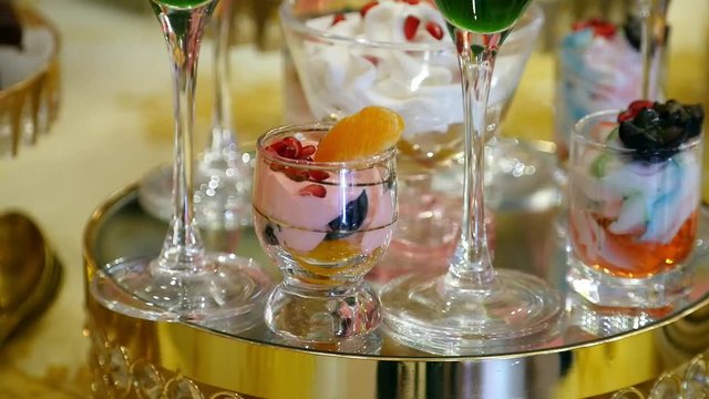 colorful fruit dessert cream and souffle in glass. wedding celebratory dinner food design slide movement